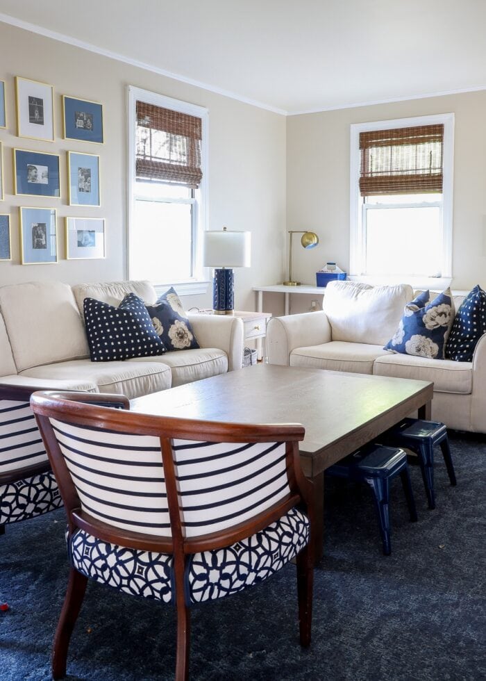 Navy and white family room with bamboo cordless shades on the window