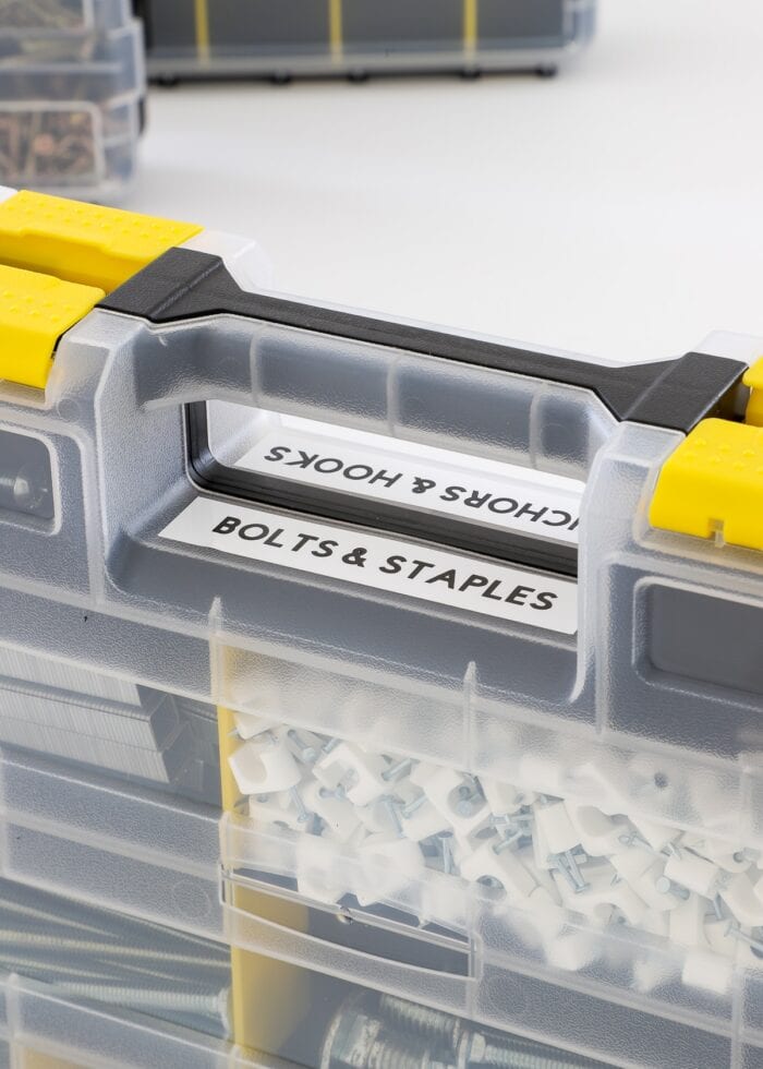 Labels on top of handles of hardware storage boxes