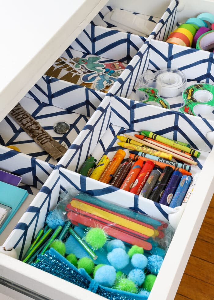 DIY Drawer Dividers inside a shallow drawer to hold art supplies