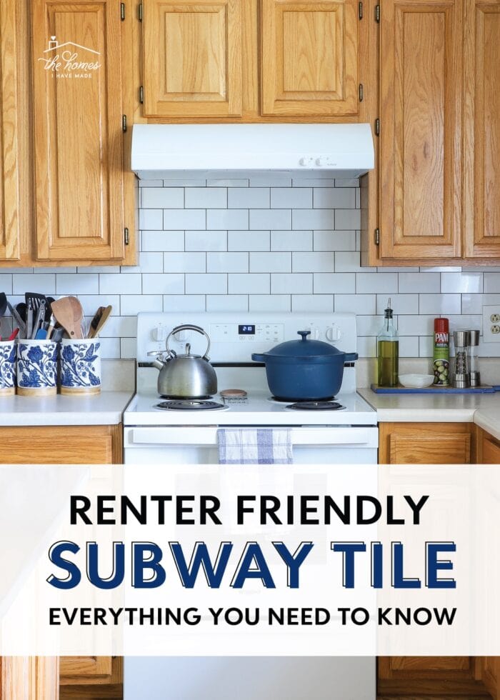 Builder-grade rental kitchen with honey oak cabinets and white peel and stick subway tile on the backsplash