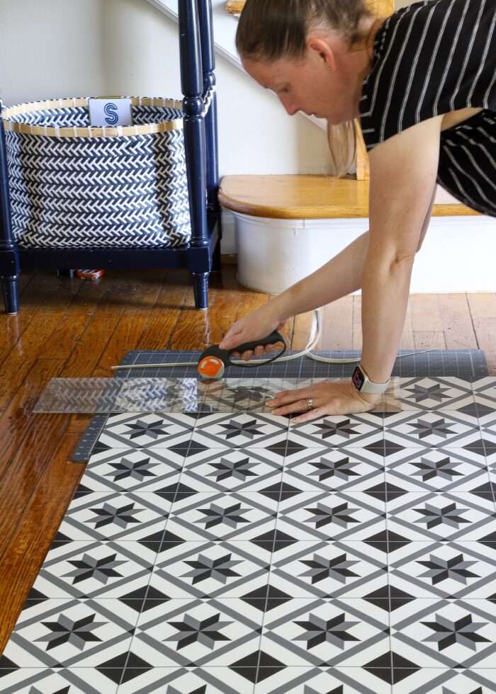Megan cutting vinyl floor mat with rotary cutter