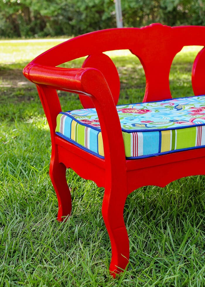 Red garden bench with new foam cushion