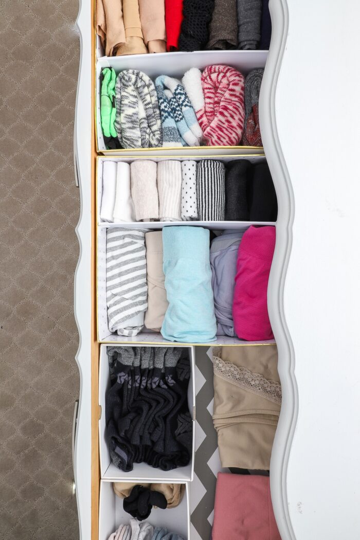 Socks and underwear in a dresser drawer organized with cardboard boxes