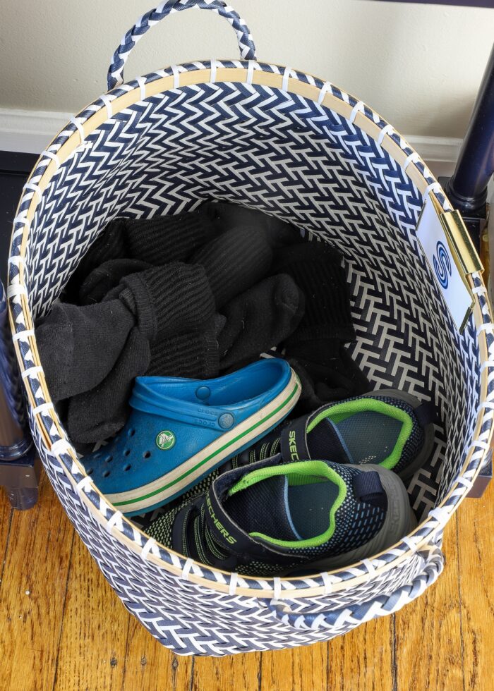 Socks and shoes in a blue woven basket