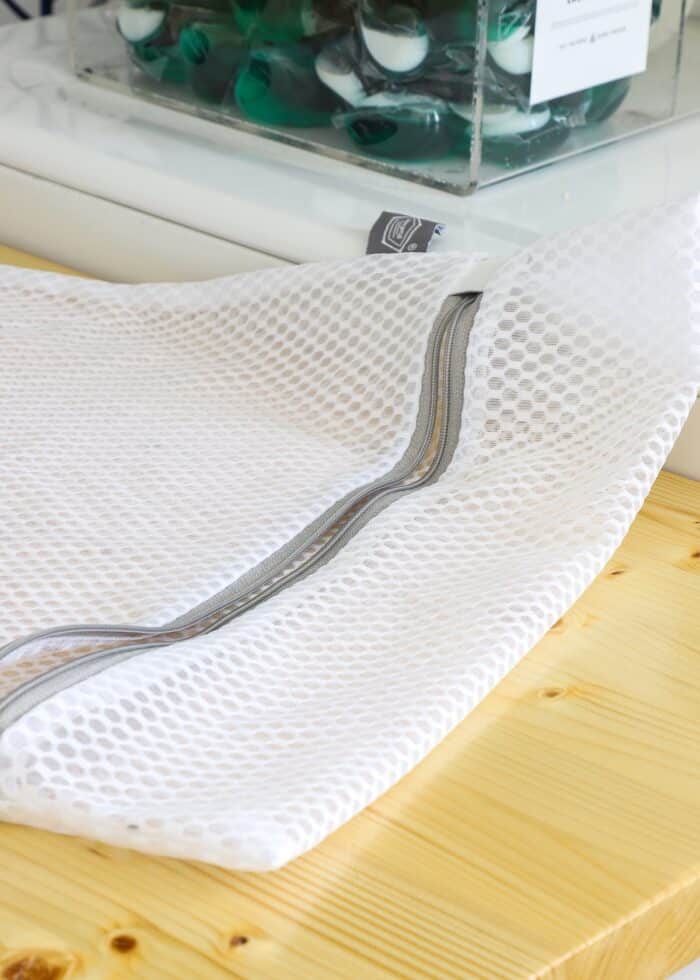 Mesh laundry bag on a wood countertop