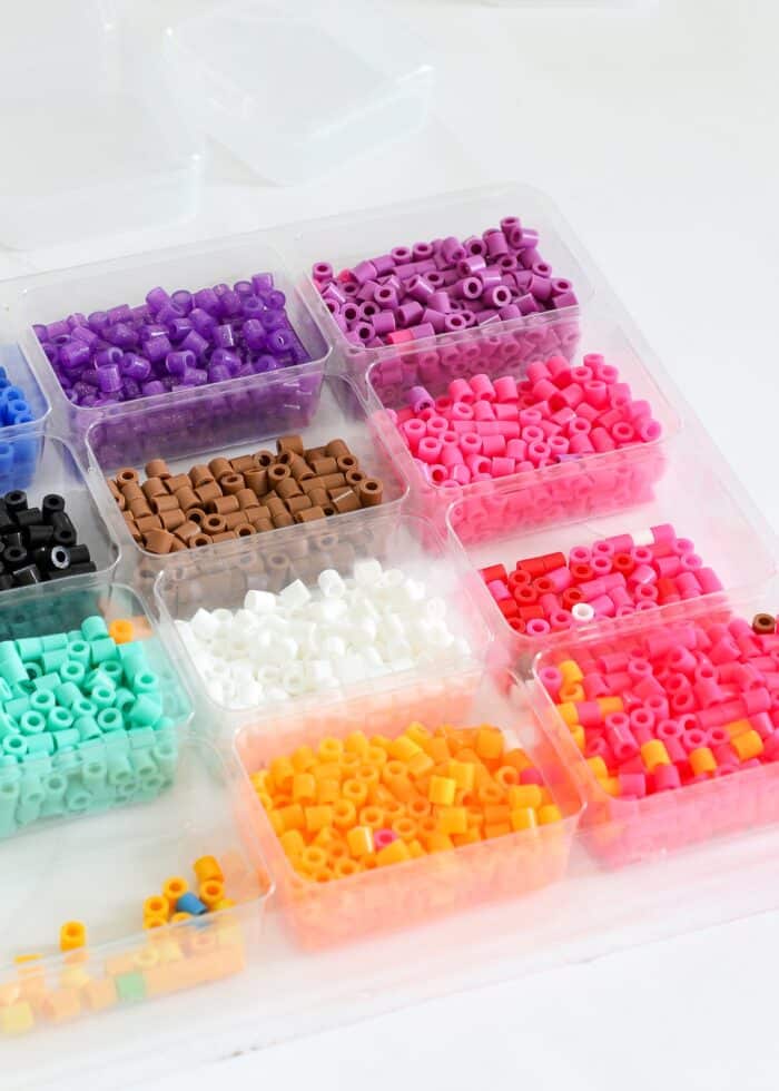 Perler beads in a plastic sorting tray
