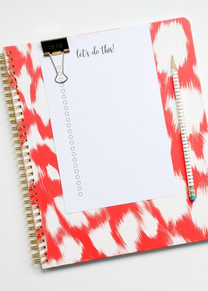 White printable to do list on an orange notebook