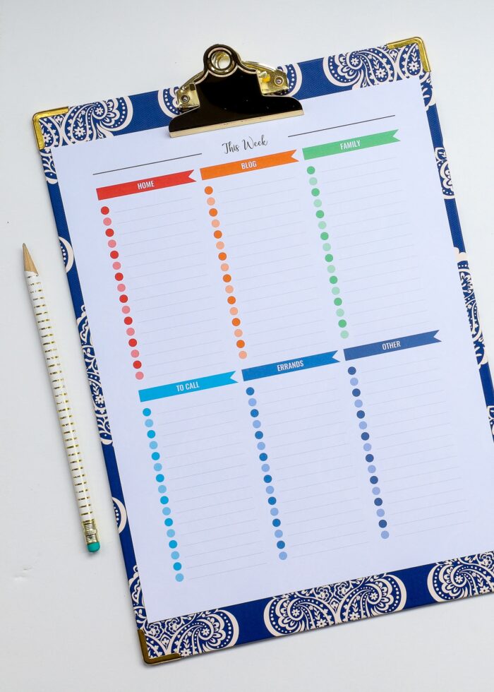 A multi-color printable to do list on a blue clipboard