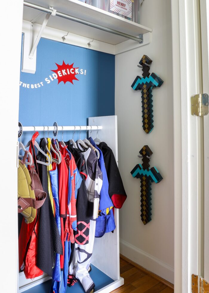 Wall-mounted swords inside a dress up closet