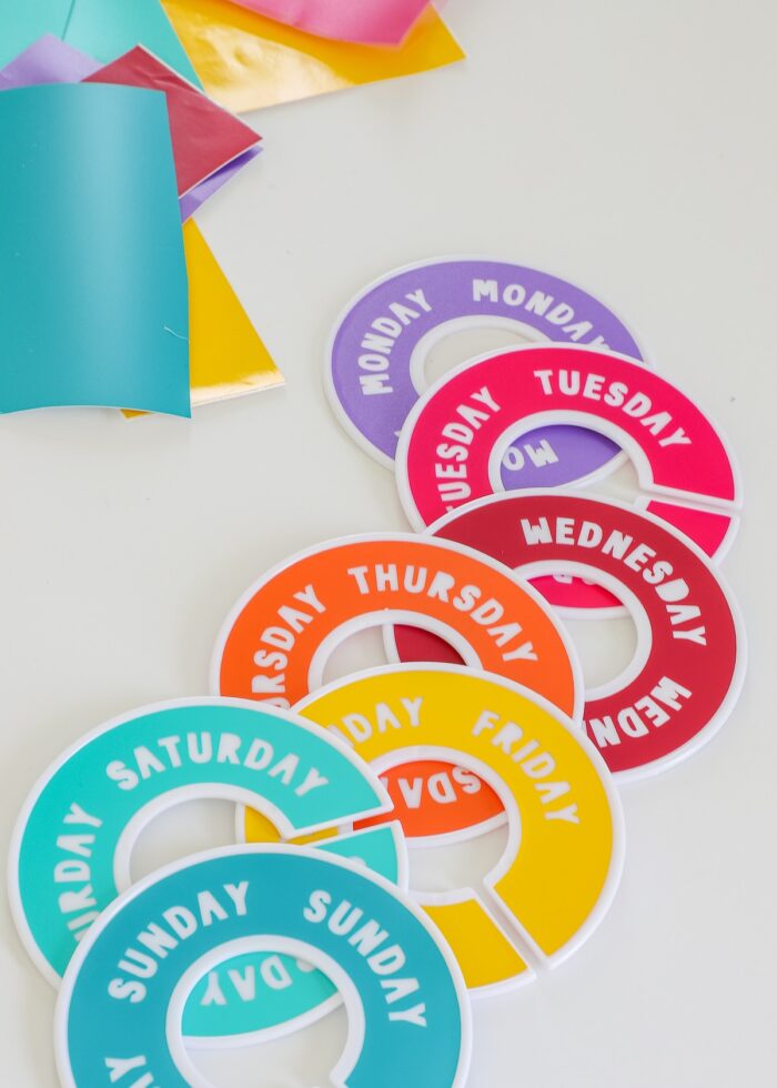 Round Day of the Week closet dividers in different colors of vinyl