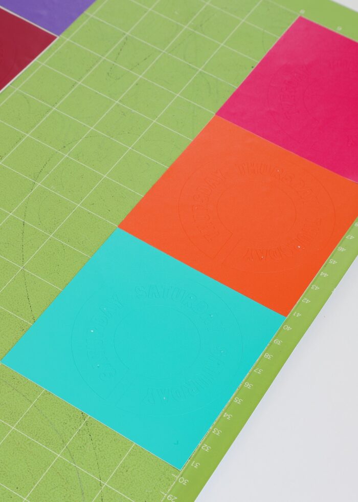 Closeup of vinyl on a green Cricut cutting mat