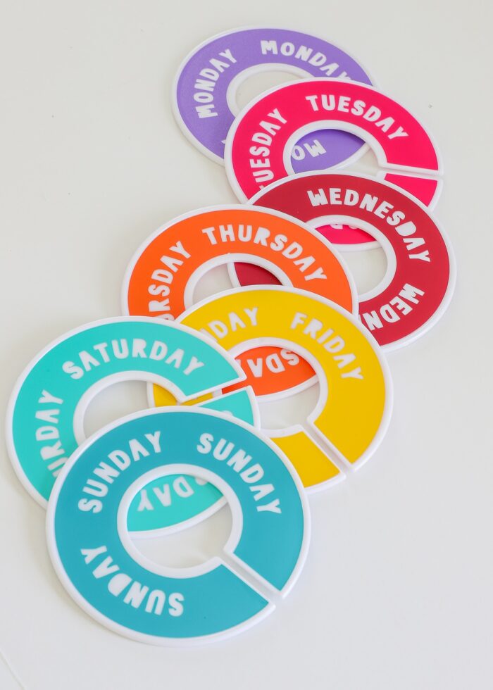 Day of the week labels applied to round closet dividers