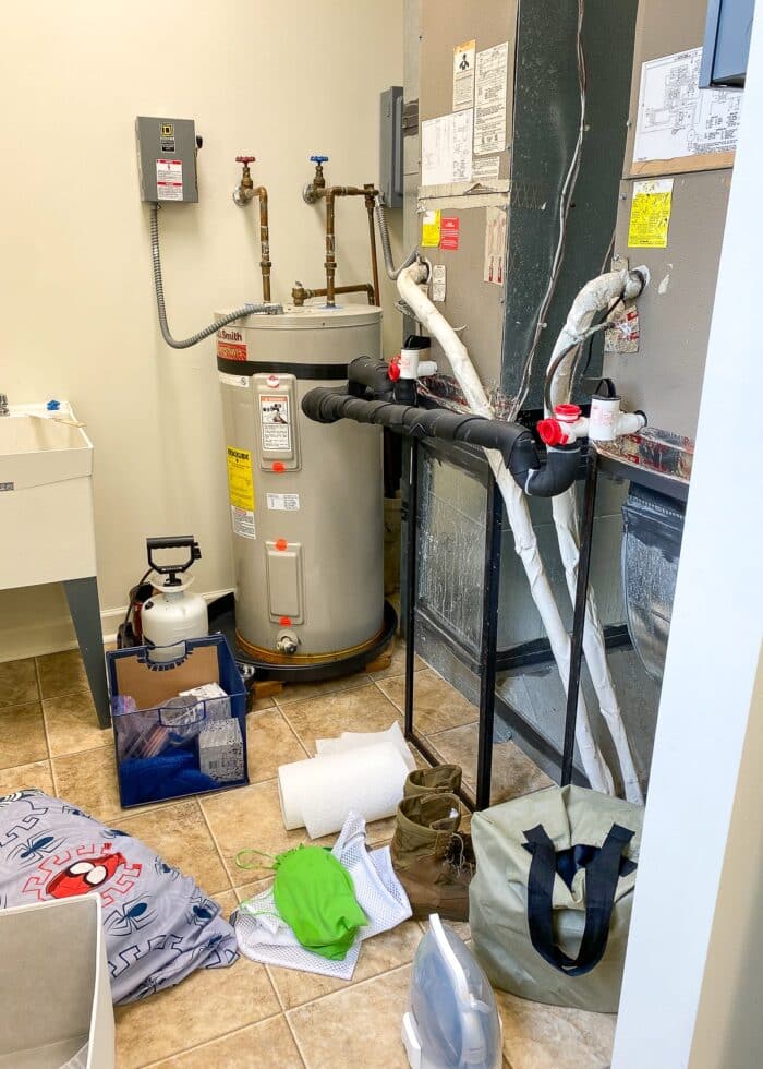 HVAC equipment and clutter in a laundry room