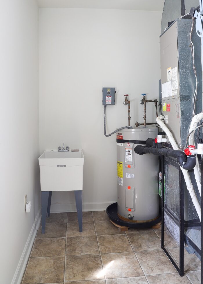 HVAC unit and utility sink in a laundry room