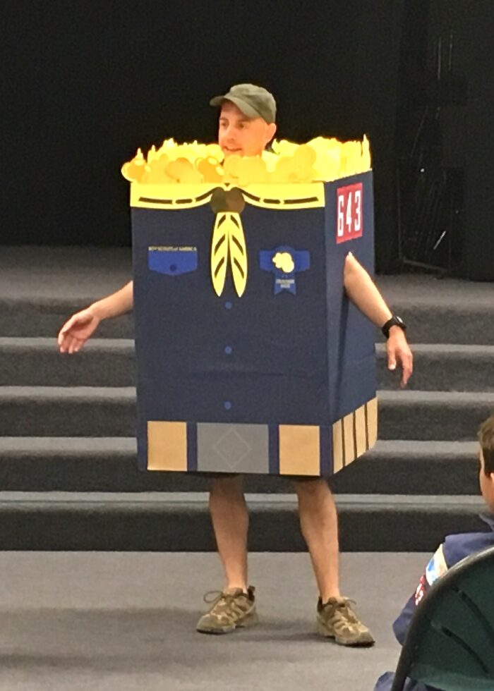 Cub Master wearing a Cub Scout Popcorn Box costume