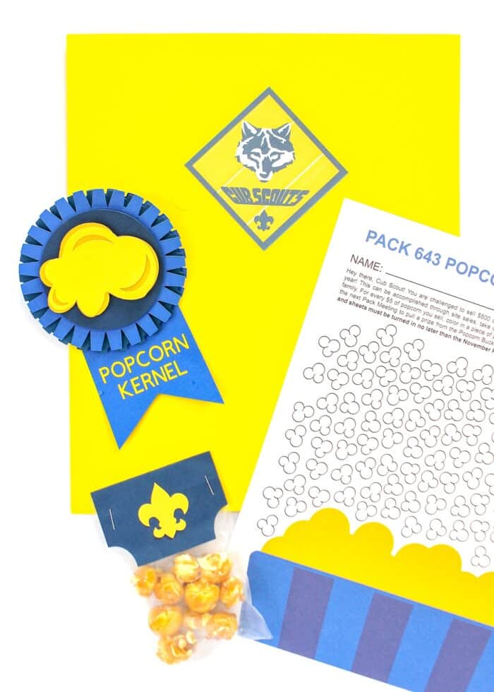 Yellow Cub Scout Folder with Popcorn Kernel Ribbon, Printable Popcorn Tracker, and sample on top