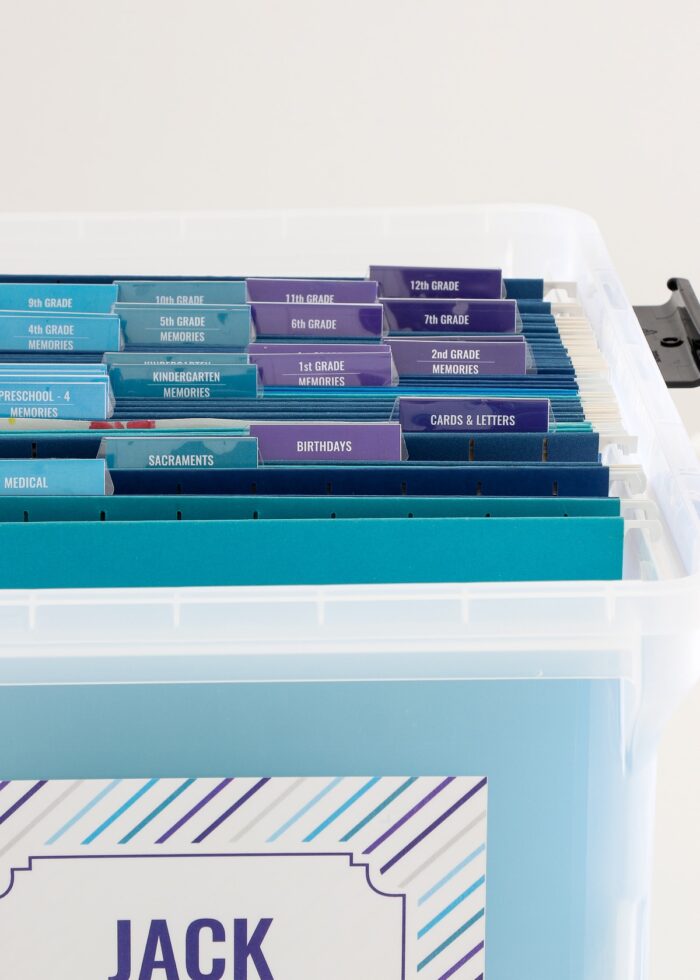 School memory box with blue file folders and grade-by-grade tabs