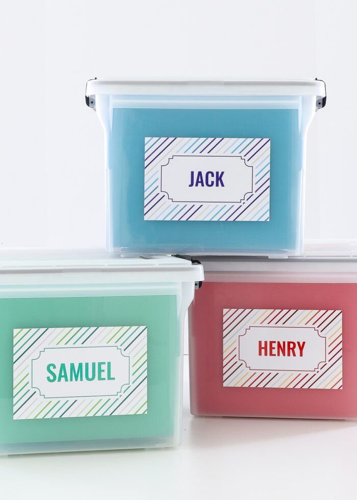 3 stacked school memory boxes in blue, green, and red