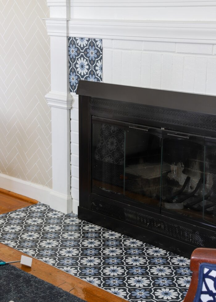 Peel and stick floor tile on rental fireplace brick surround