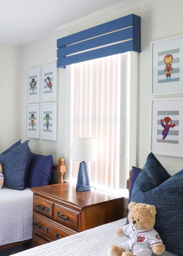 Blue and white child room with blue wooden valance on the window