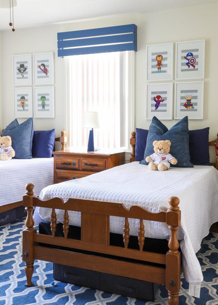 Kids' blue and white bedroom with wood valance on window