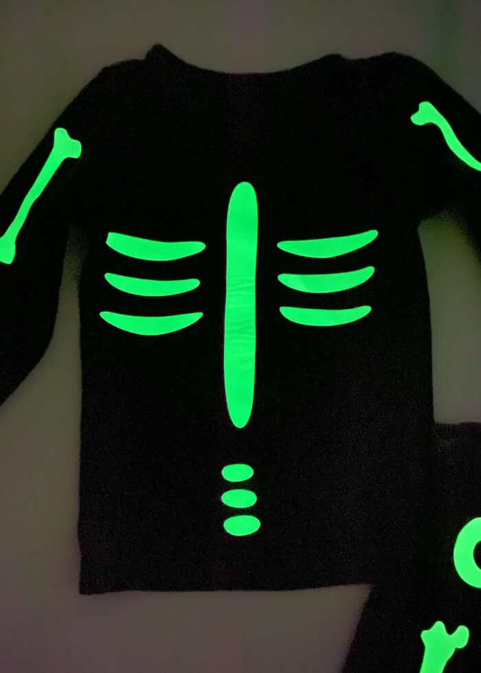 Black shirt with glow-in-the-dark bones ironed on to create a skeleton costume