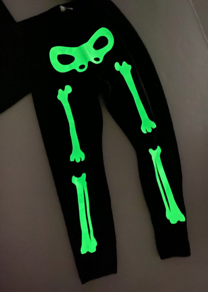 Black pants with glow-in-the-dark bones ironed on to create a skeleton costume