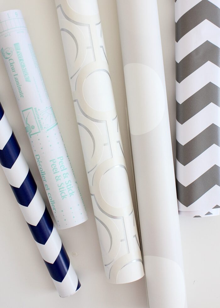 Various rolls of contact paper, wallpaper, and wrapping paper to be used as drawer liners