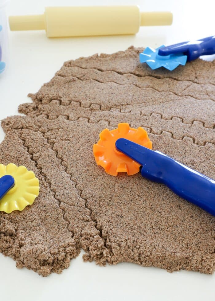 Dough Design Wheels shown with Kinetic Sand