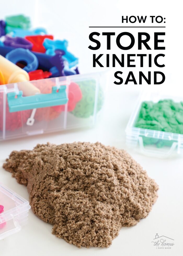 A pile of brown Kinetic Sand shown alongside a carrying caddy full of toys and tools