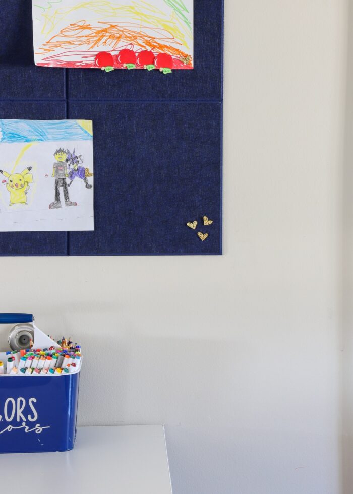 Kids art bulletin board out of blue felt tiles