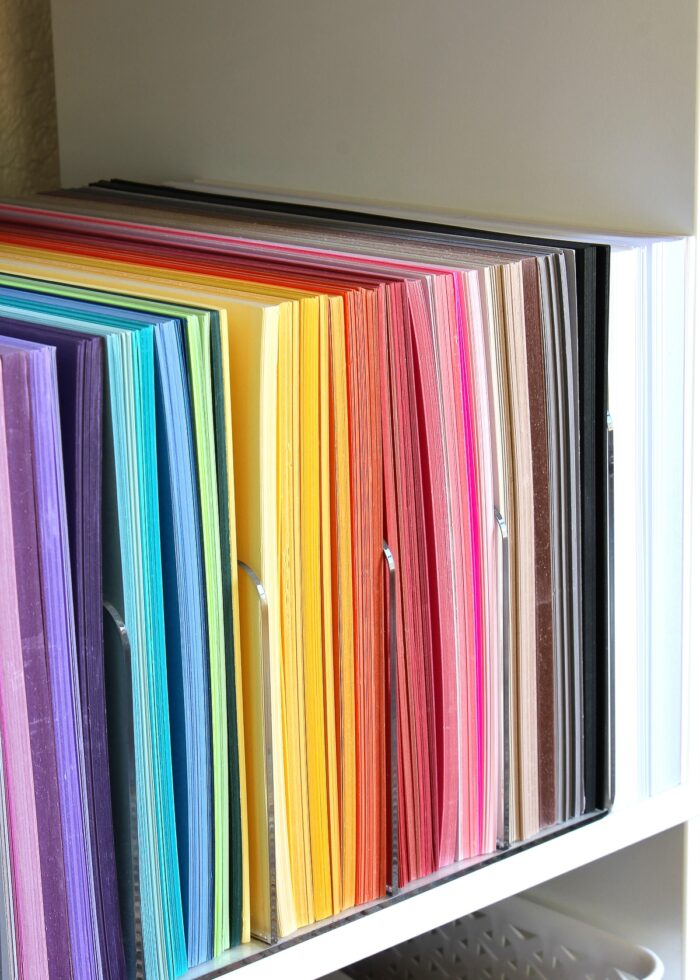 Colored cardstock sorted and organized with clear acrylic dividers