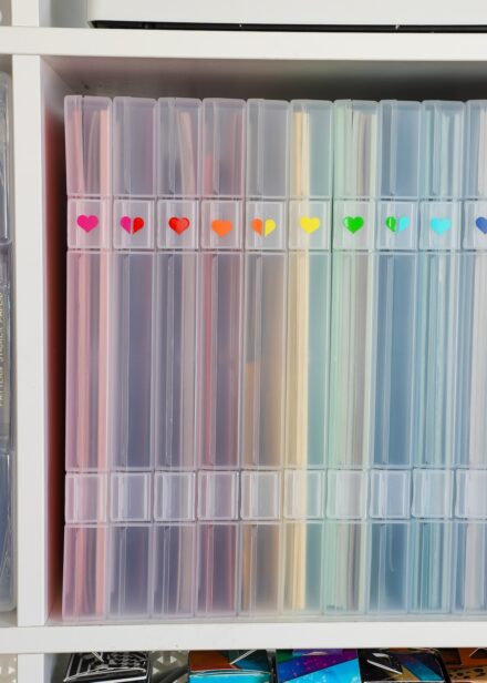 Craft paper storage boxes on a white IKEA Kallax shelf