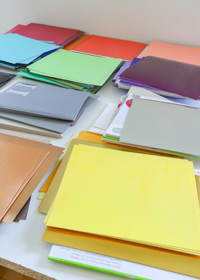 Messy piles of cardstock in every color