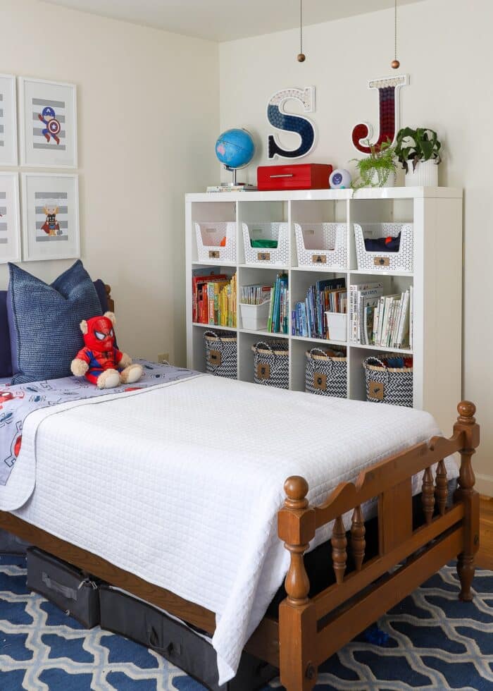 Red, white, and blue child's bedroom with DIY Pom Pom Letter wall art hung on wall