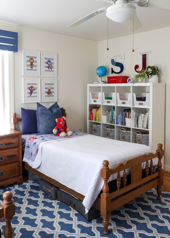 Red, white, and blue child's bedroom with DIY Pom Pom Letter wall art hung on wall