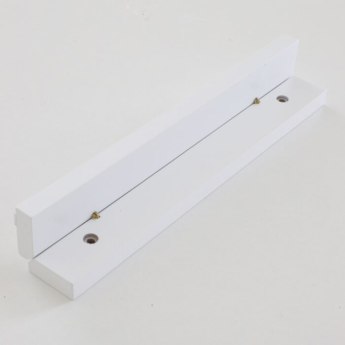 Open magnetic clamp on a white table