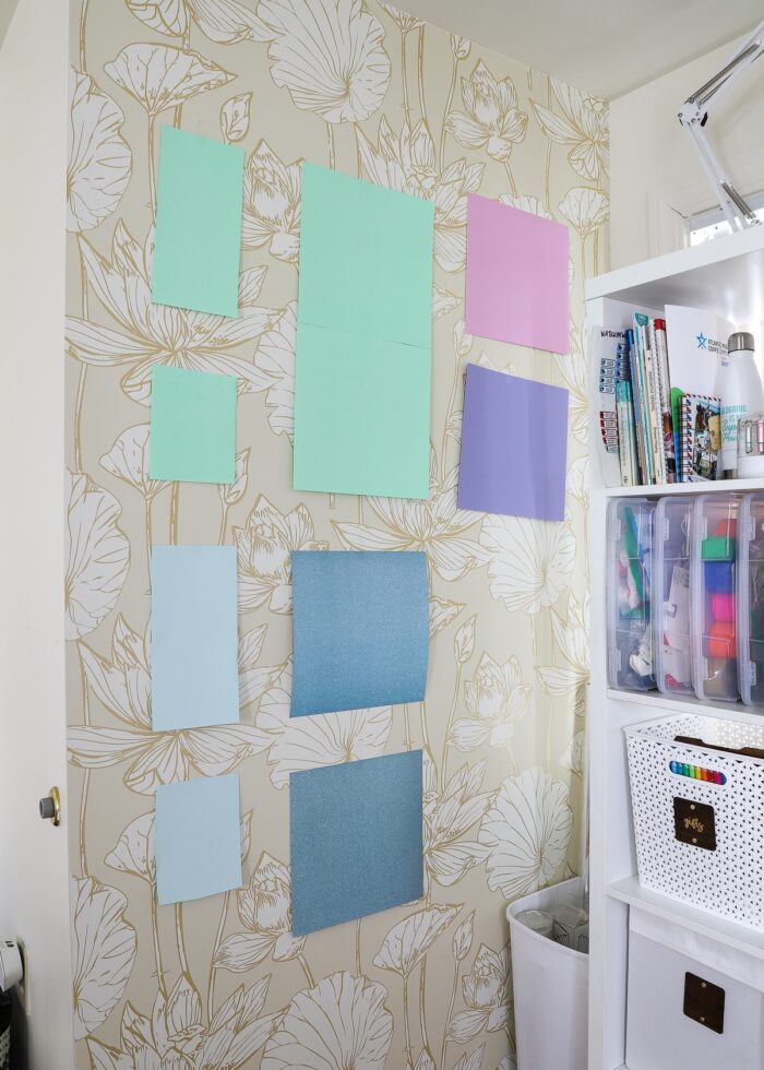 Sheets of cardstock on a wall to plan out where to store Cricut mats in all shapes and sizes.