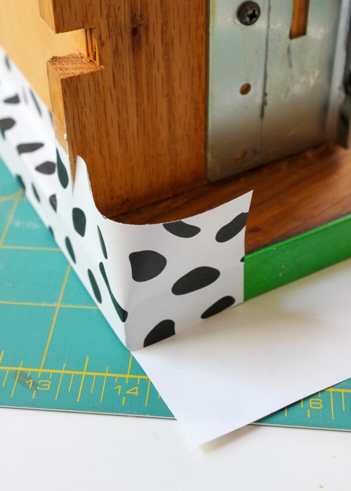 Folding wallpaper around a dresser drawer corner