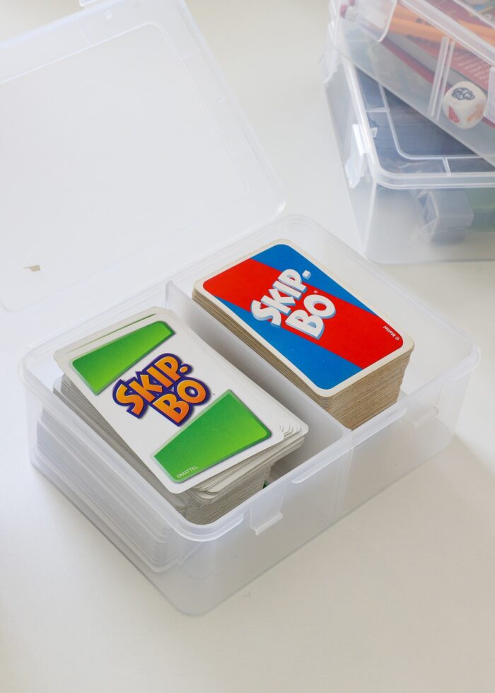 Skip-Bo card games loaded into clear plastic card box