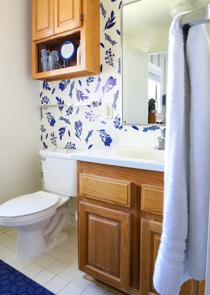 Rental bathroom decorated with blue flower bathroom wall stickers