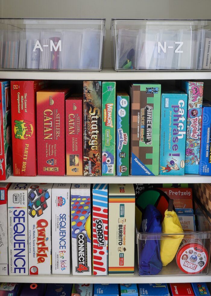 Organized board game closet shelves