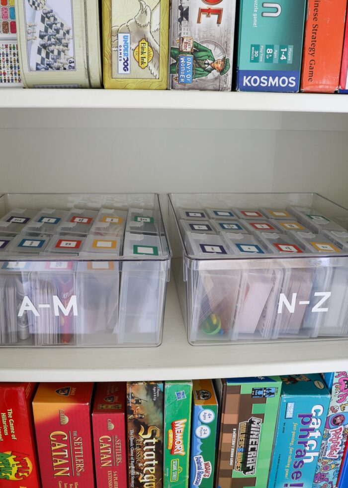 Small card games loaded into plastic card cases and organized alphabetically