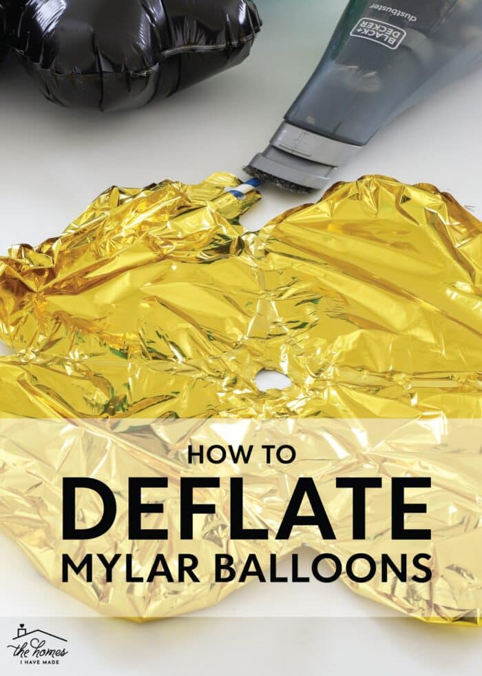 Gold mylar balloon deflated with a straw and a handheld vacuum