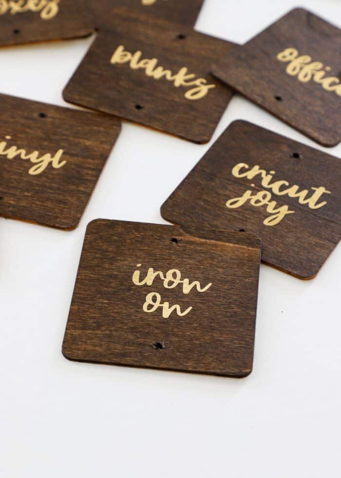 Gold foil text on stained wood labels