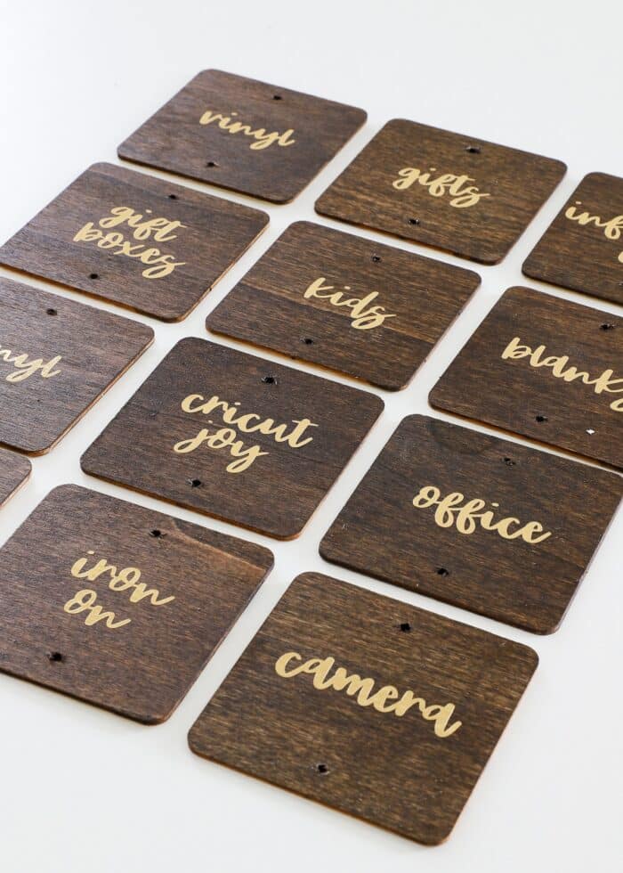 Wood labels with gold foil text in vinyl
