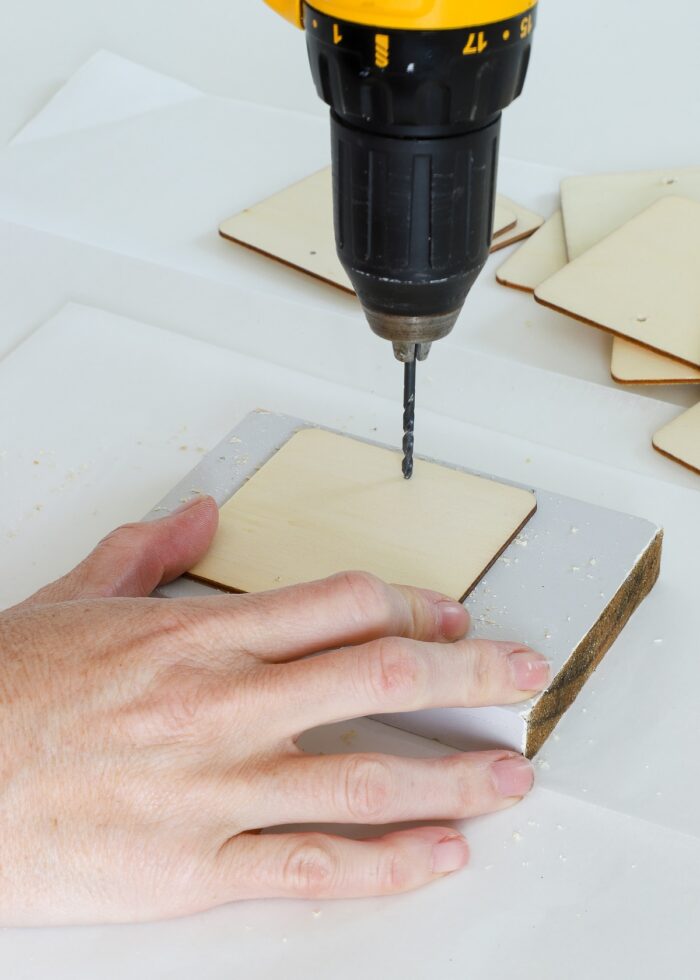 Drilling holes in wooden squares