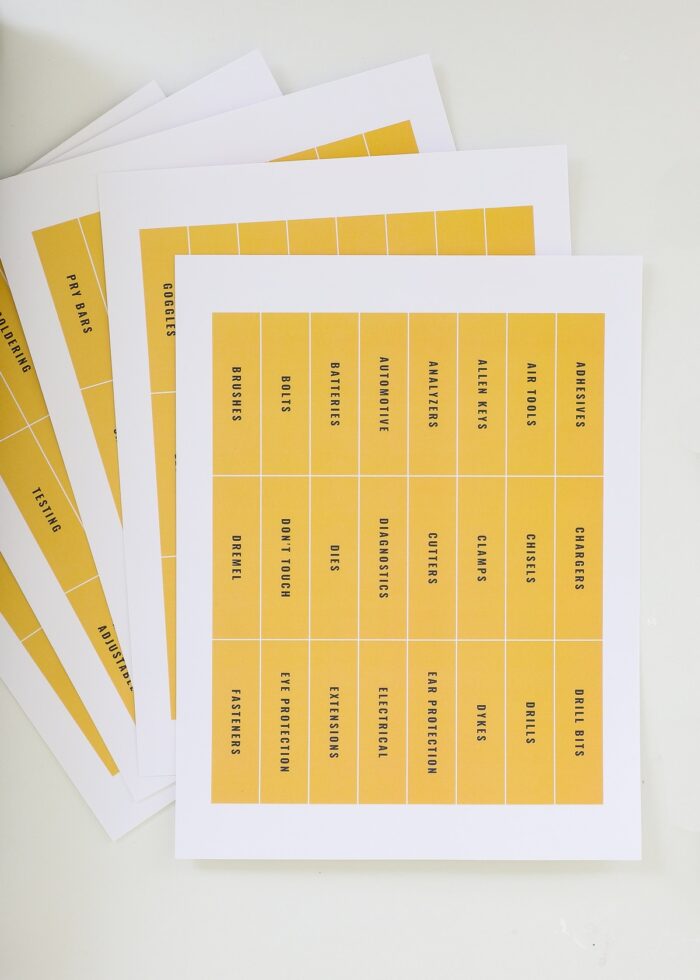 Yellow printed toolbox labels on white paper