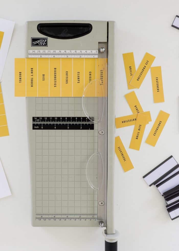Paper trimmer shown cutting down printable toolbox labels