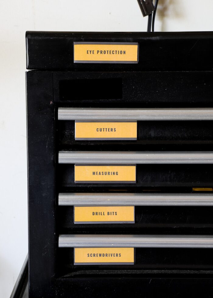 Yellow magnetic toolbox labels on a black rolling Husky toolbox